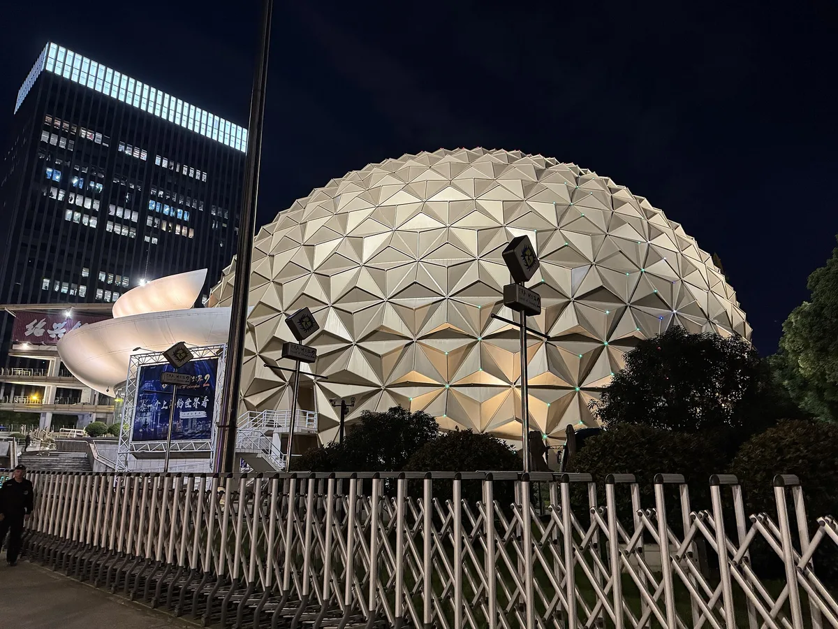 Shanghai Circus World's geodesic dome illuminated at night